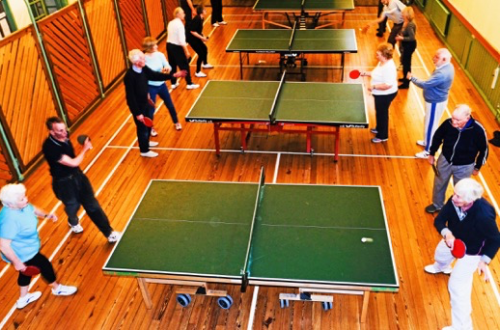 Members of Farnham U3A playing table tennis.